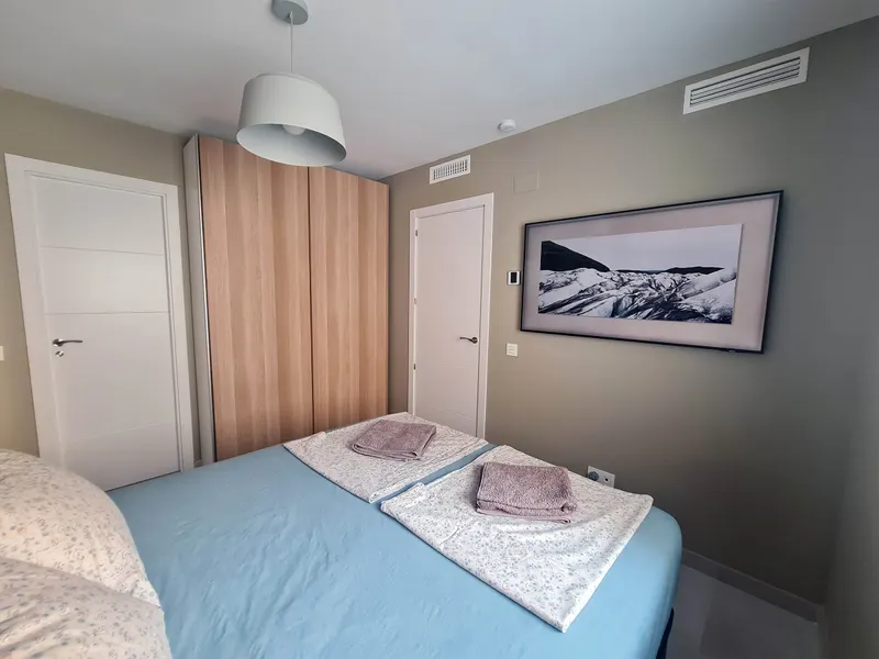Master bedroom with en-suite bathroom and TV